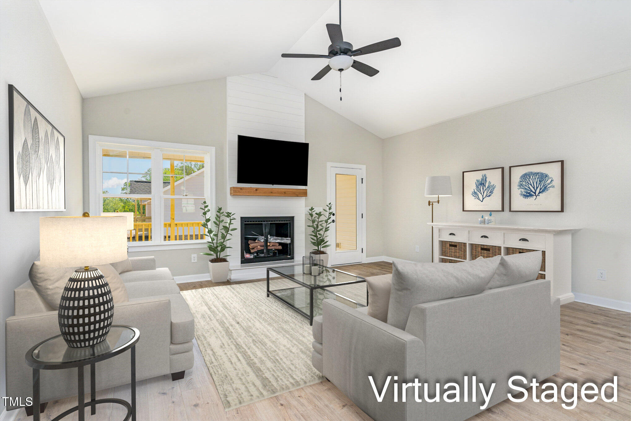 30 Tee Drive Selma, NC 27576 - Photo 8 of 28 a living room with furniture a fireplace and a flat screen tv