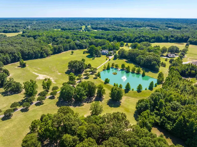 a view of a lake with a yard