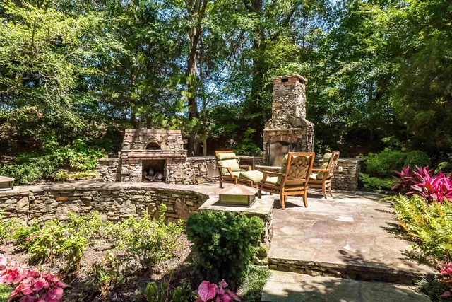 a view of a patio with table and chairs and potted plants