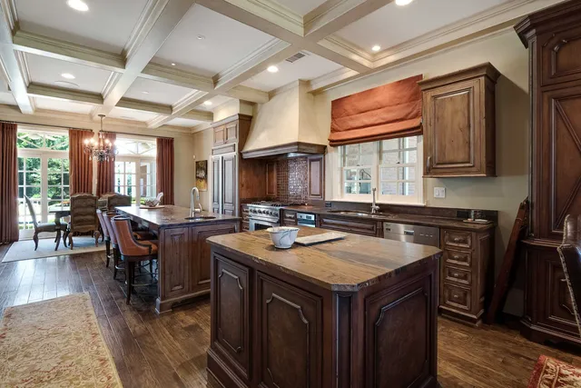 a kitchen with a stove a sink and a refrigerator