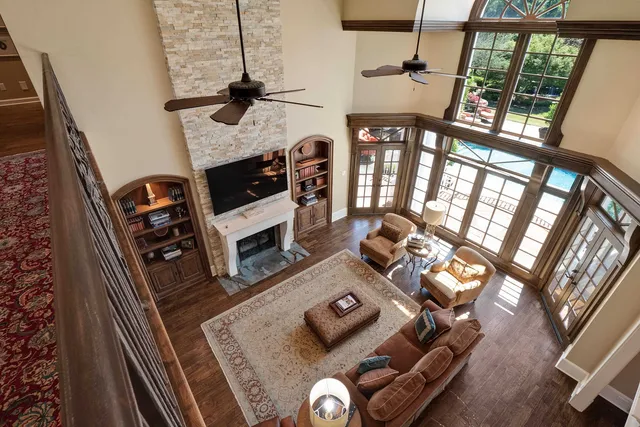 a living room with furniture and a fireplace