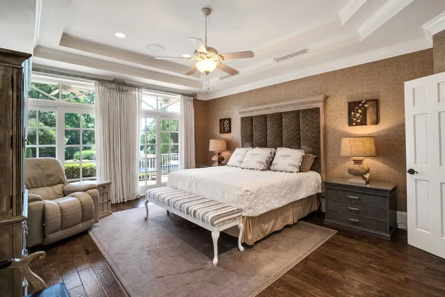 a bedroom with a large bed and a couch
