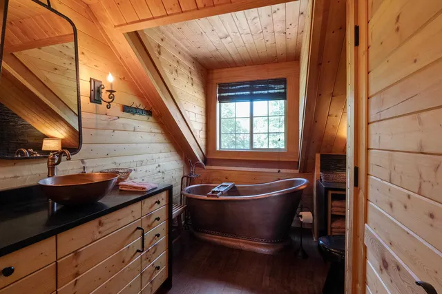 a room with granite countertop stainless steel appliances a sink and a window