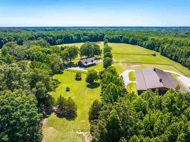 a view of a swimming pool with a yard