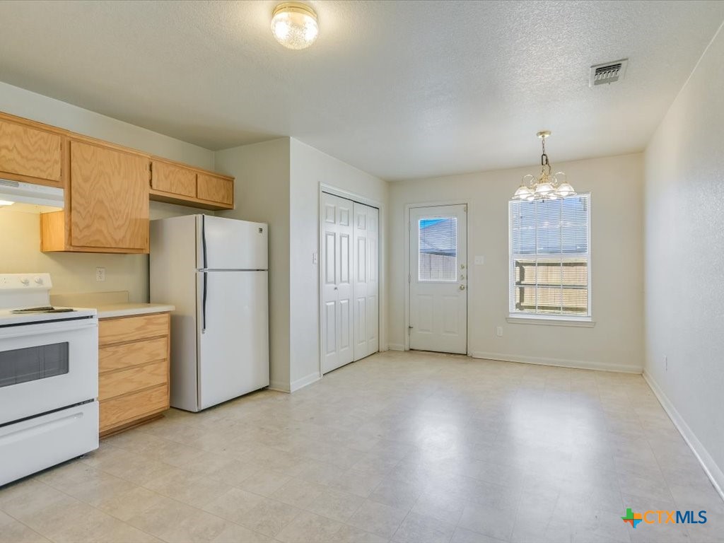 3805 El Paso Drive, Unit A Killeen, TX 76549 - Photo 8 of 20 a view of a kitchen with refrigerator and cabinet