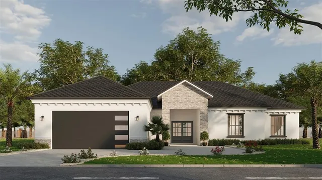 a front view of house with a garden