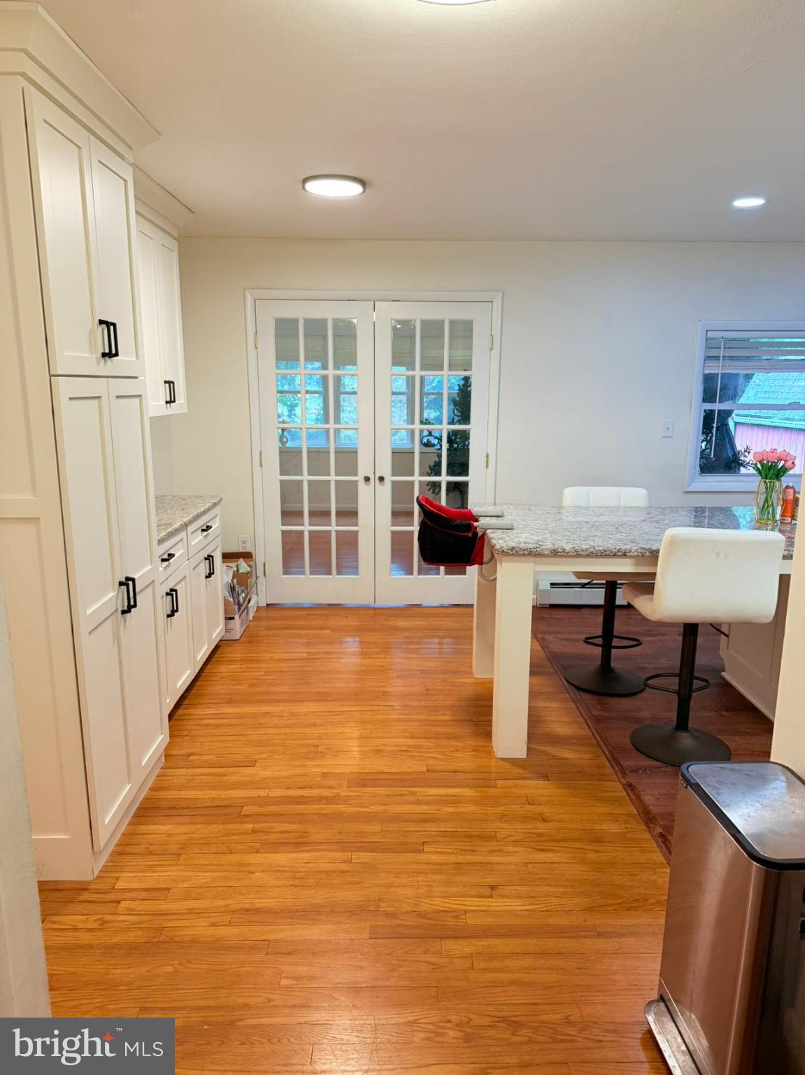 242 Spring Street State College, PA 16801 - Photo 14 of 75 a living room with furniture floor to ceiling window and wooden floor