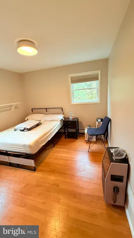 a view of room with window and hardwood floor
