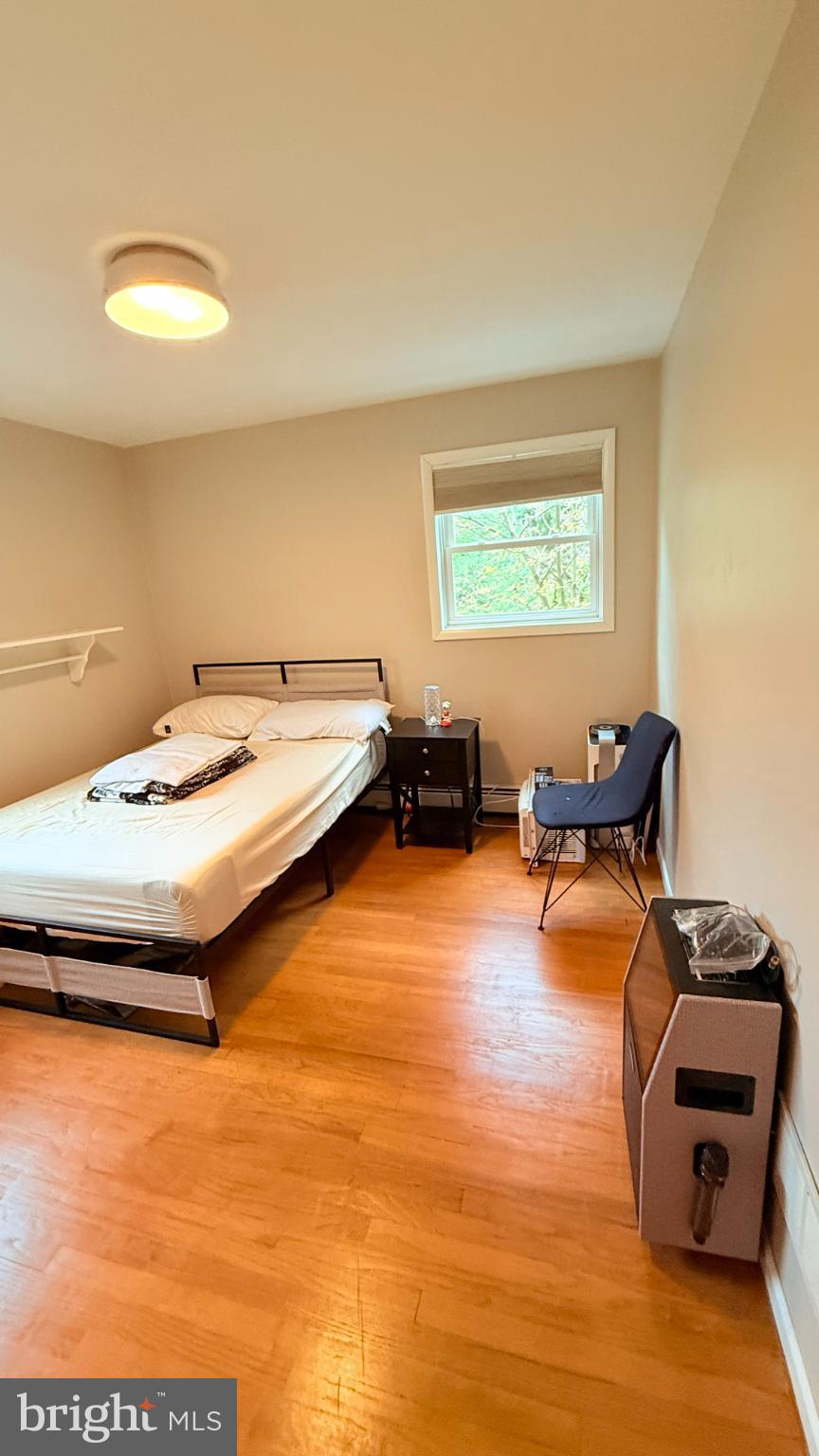 242 Spring Street State College, PA 16801 - Photo 28 of 75 a room with furniture and a wooden floor