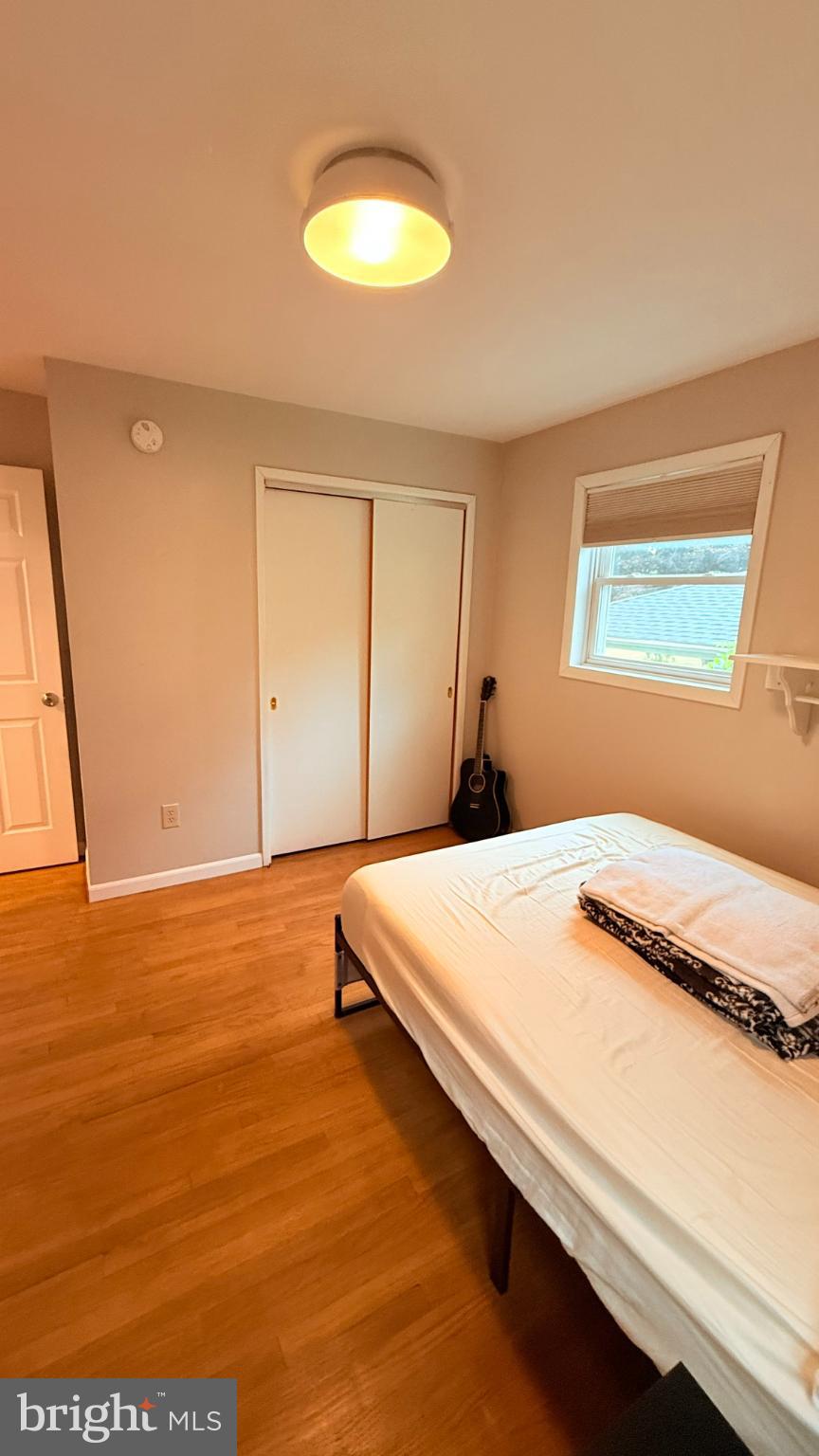 242 Spring Street State College, PA 16801 - Photo 29 of 75 a bedroom with a bed and a window