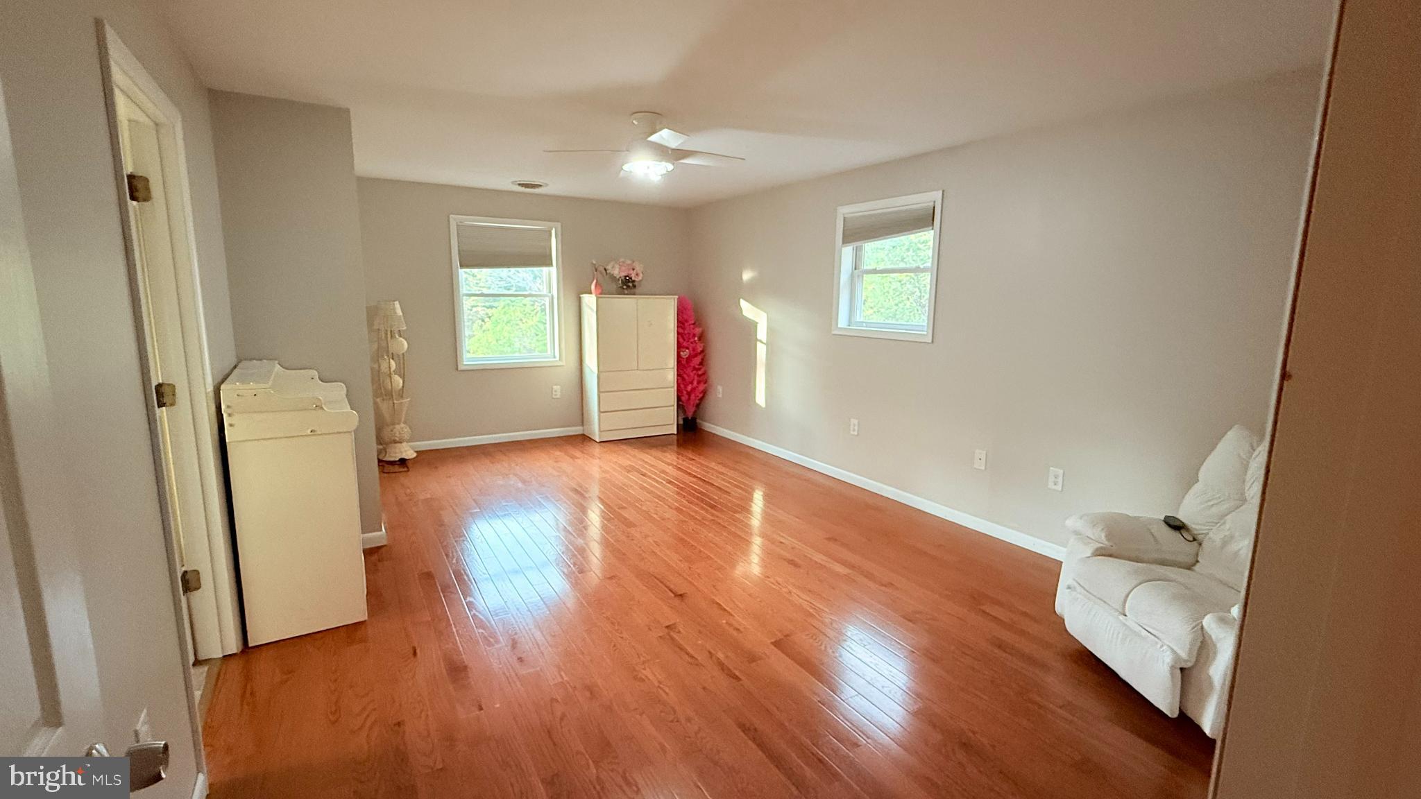 242 Spring Street State College, PA 16801 - Photo 35 of 75 a view of empty room with wooden floor and fan