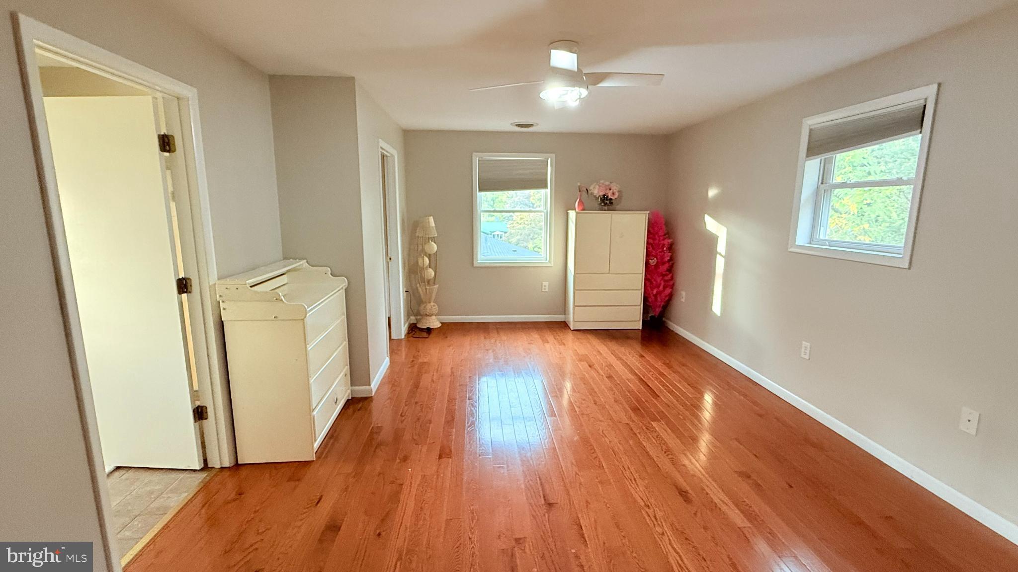 242 Spring Street State College, PA 16801 - Photo 36 of 75 wooden floor in an empty room with a window
