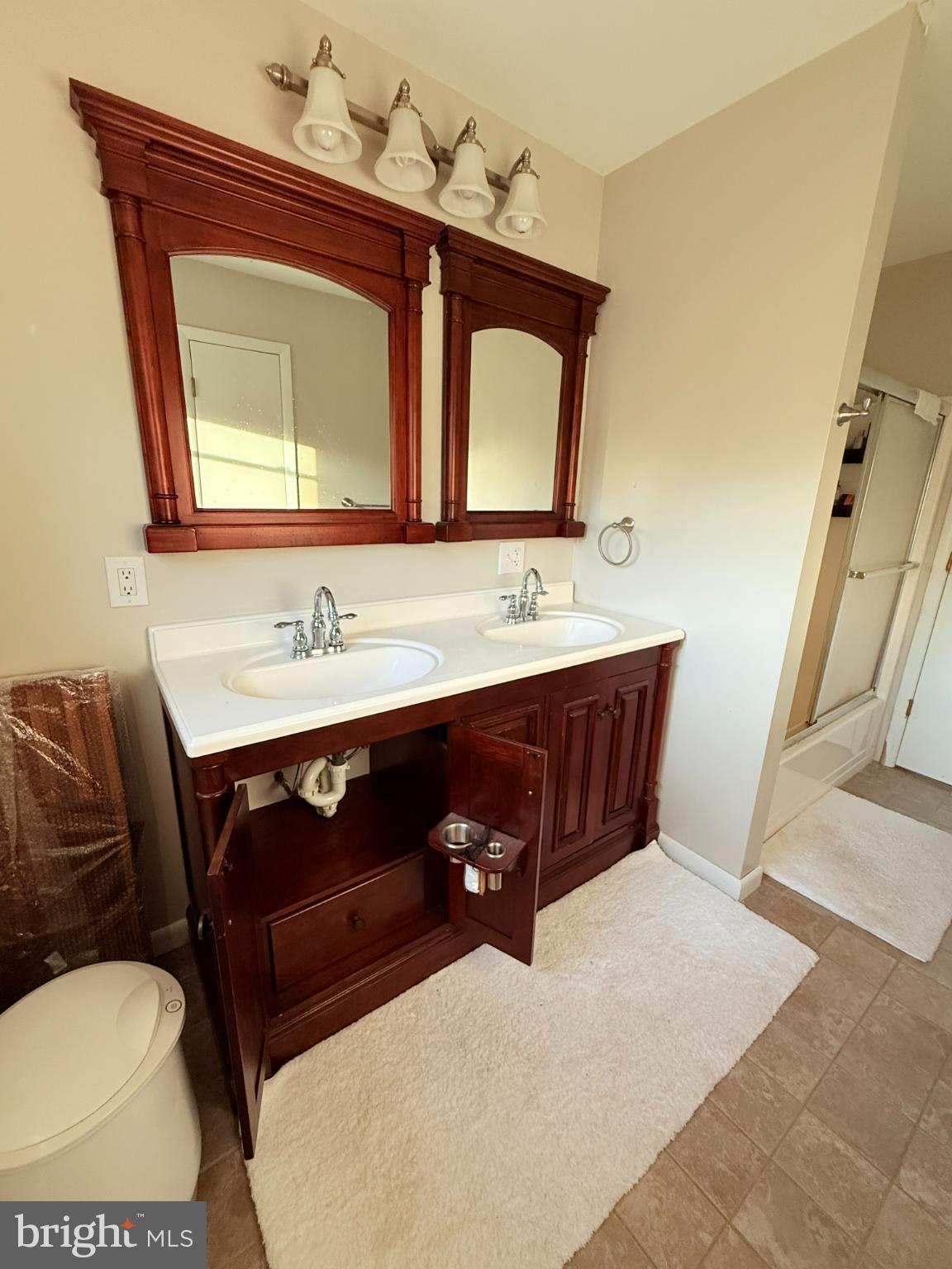 242 Spring Street State College, PA 16801 - Photo 42 of 75 a bathroom with a toilet sink and mirror