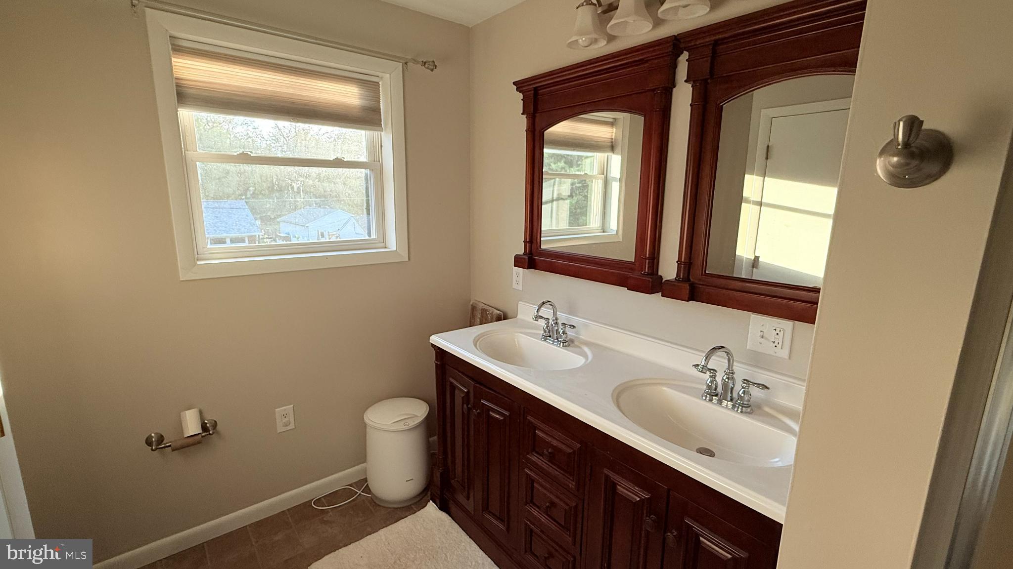 242 Spring Street State College, PA 16801 - Photo 46 of 75 a bathroom with 2 sink and a mirror