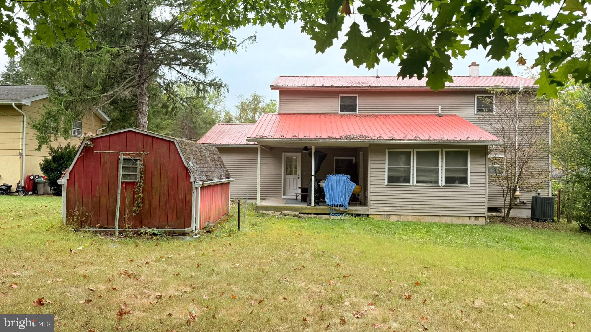 242 Spring Street State College, PA 16801 - Photo 5 of 75 a view of a house with a yard and sitting area