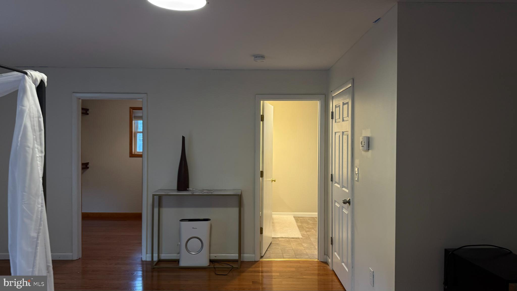 242 Spring Street State College, PA 16801 - Photo 54 of 75 a view of a hallway with wooden floor and stairs