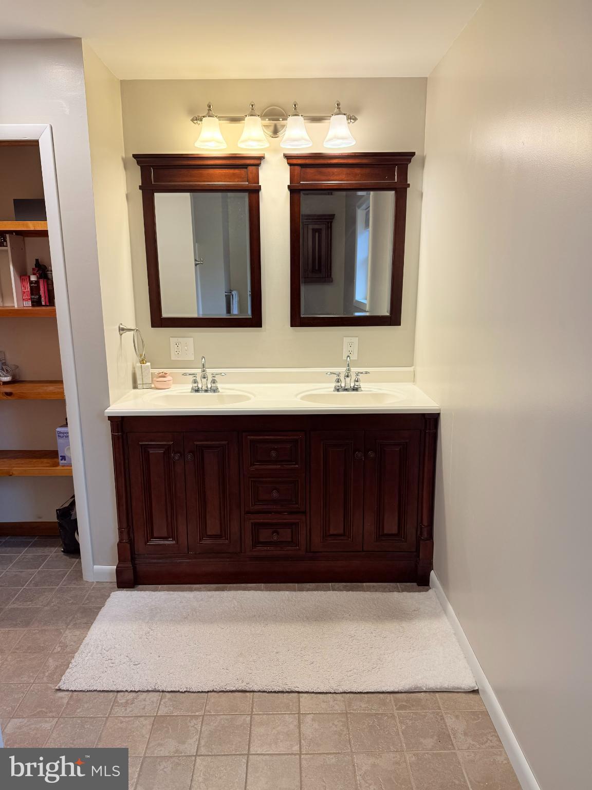 242 Spring Street State College, PA 16801 - Photo 55 of 75 a bathroom with a sink and a mirror