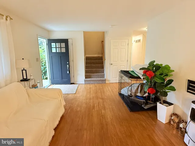 a kitchen with granite countertop a sink appliances and cabinets