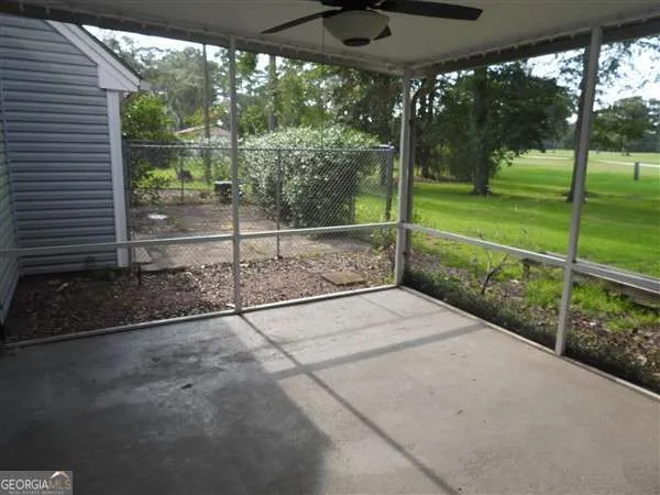 a view of a backyard with porch