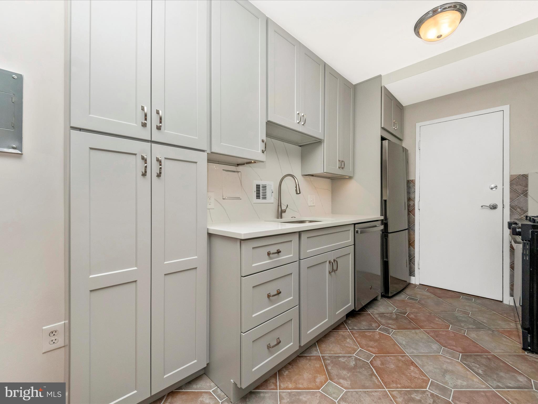 3900 Tunlaw Road Northwest, Unit 104 Washington, DC 20007 - Photo 12 of 36 View of beautiful kitchen cabinets.