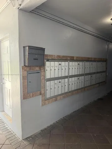 a room with a window and a flat screen tv