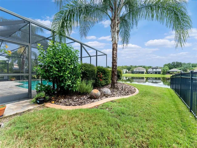 a large kitchen with a table and chairs
