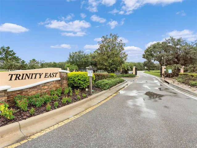 a view of a street with a park
