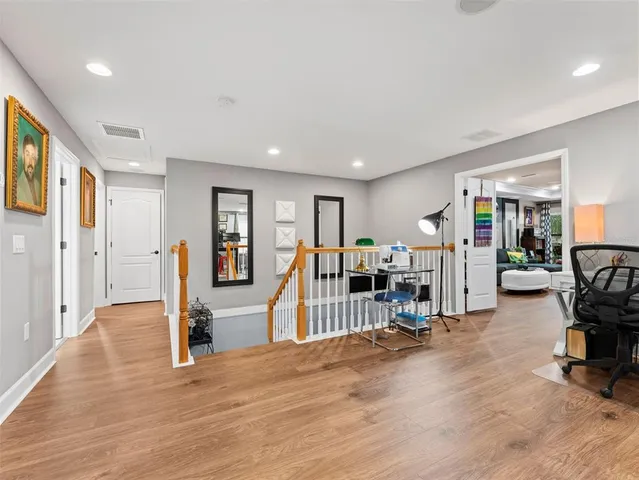 a bathroom with a sink a large mirror and a bathtub