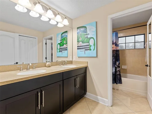 a bedroom with furniture and flat screen tv