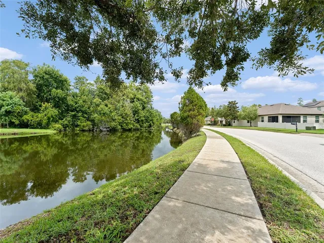 a view of a lake with houses in the background