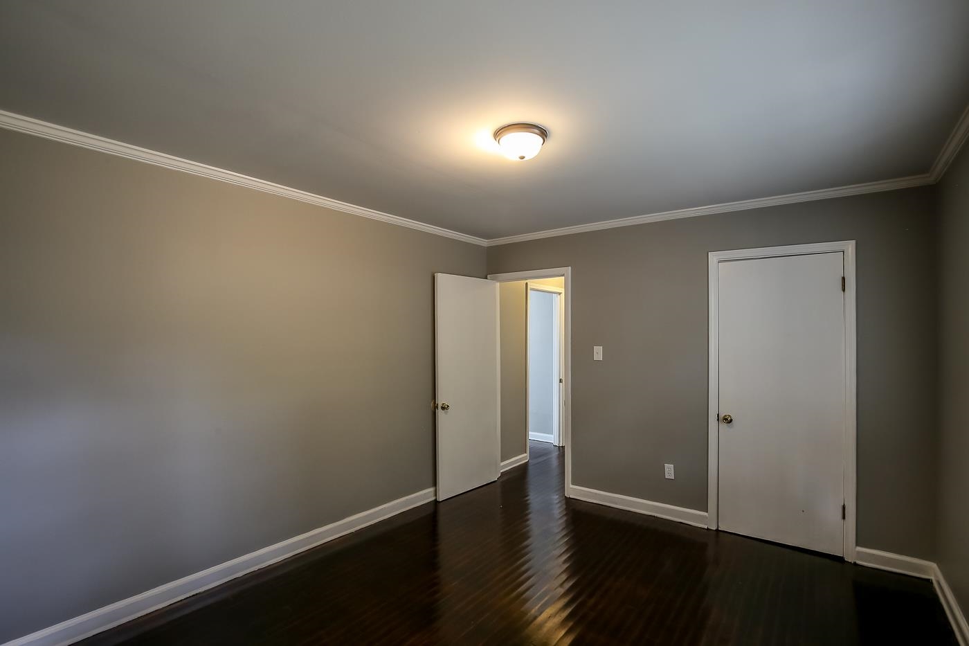 746 Waring Road Memphis, TN 38122 - Photo 8 of 16 Unfurnished room with hardwood / wood-style flooring and crown molding