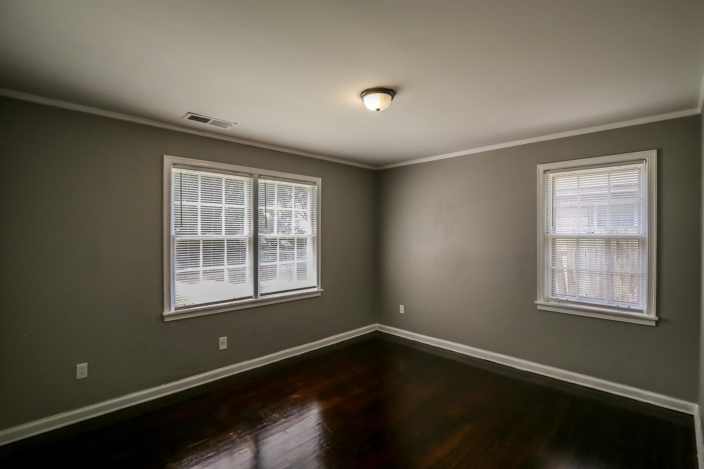 746 Waring Road Memphis, TN 38122 - Photo 10 of 16 Spare room featuring crown molding and wood-type flooring