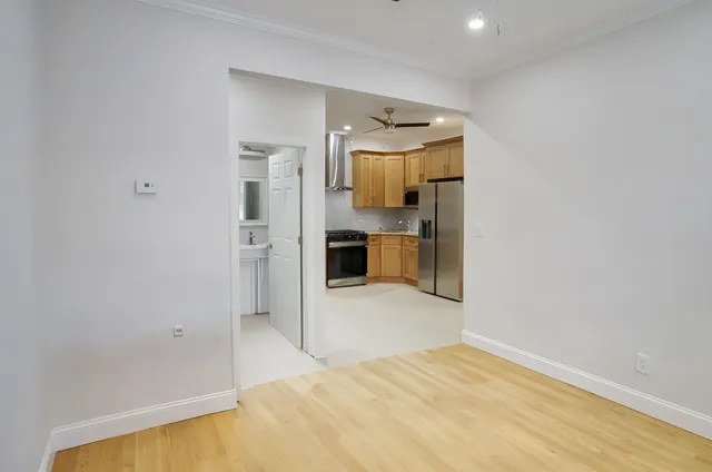 a view of a kitchen cabinets and wooden floor