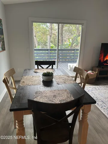 a view of a dining room with furniture window and outside view