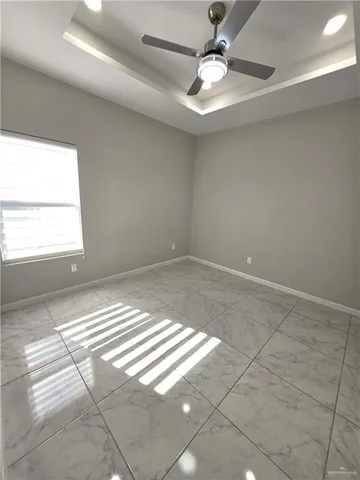 a view of an empty room and window