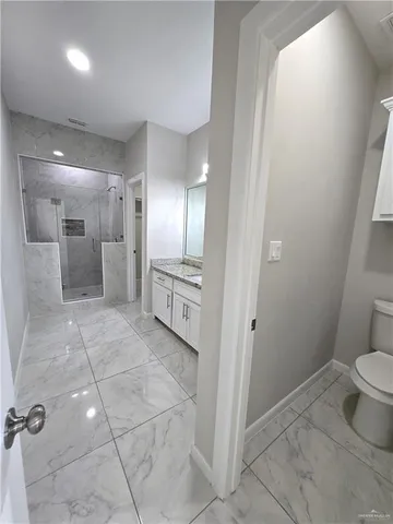 a bathroom with a sink and mirror