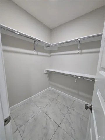 a view of a room with racks on the wall