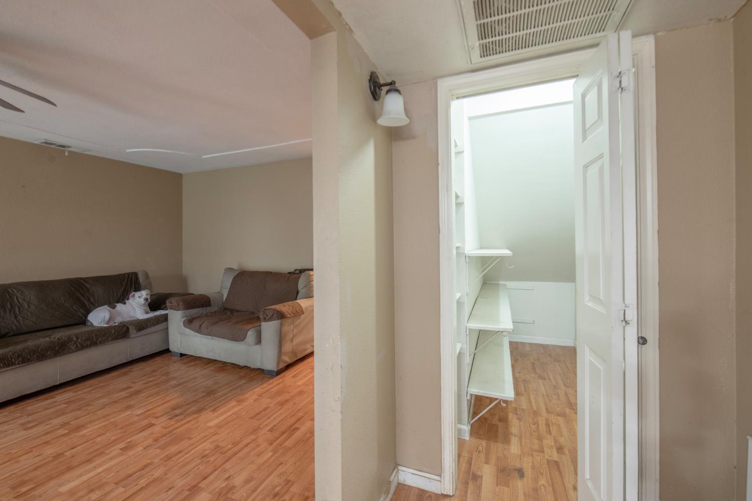 14531 West Kearney Boulevard Kerman, CA 93630 - Photo 12 of 22 a living room with furniture and a wooden floor