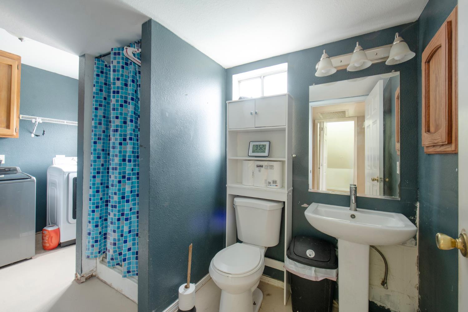 14531 West Kearney Boulevard Kerman, CA 93630 - Photo 13 of 22 a bathroom with a sink toilet and shower