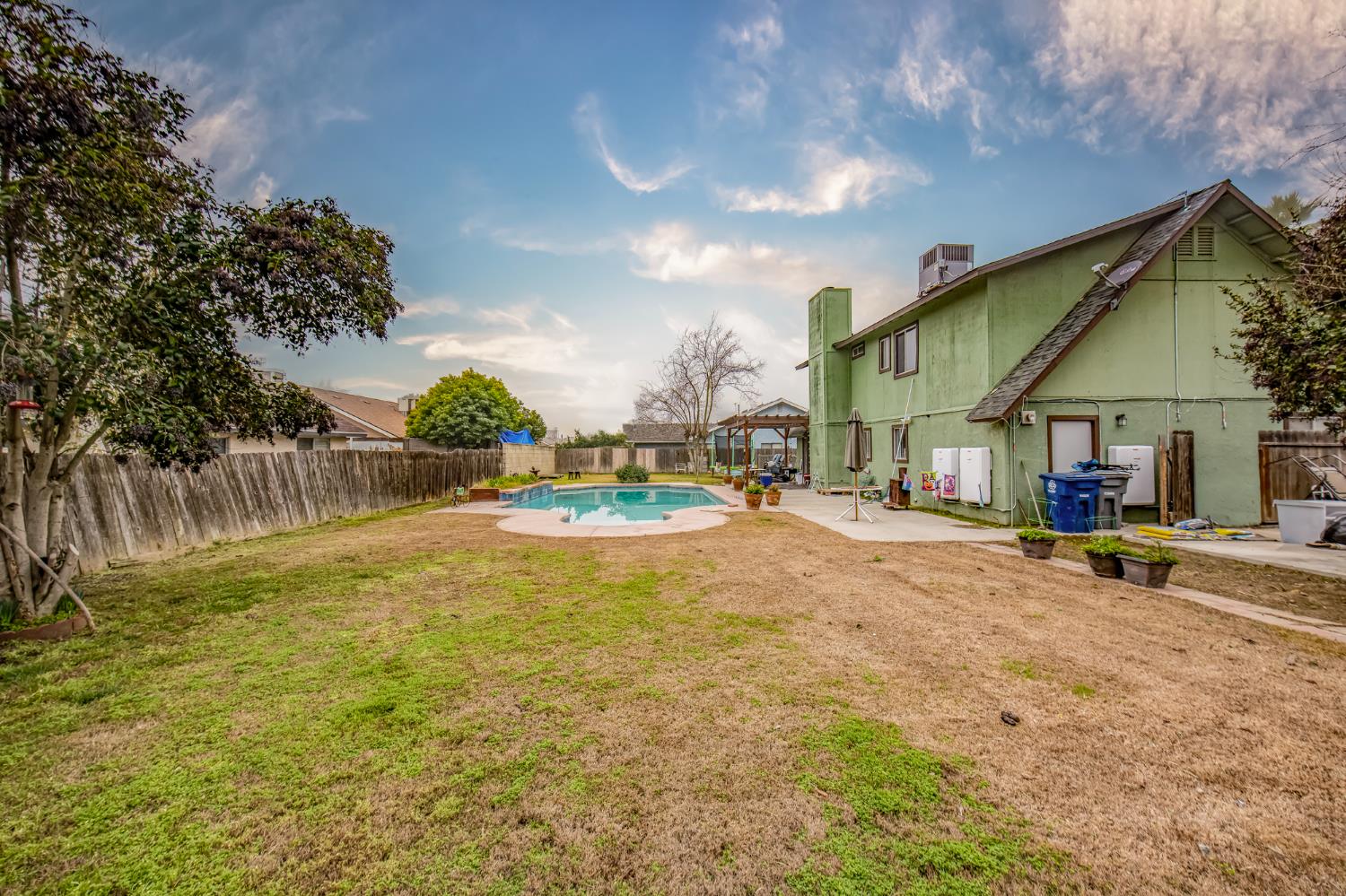 14531 West Kearney Boulevard Kerman, CA 93630 - Photo 14 of 22 a view of a house with swimming pool and sitting area