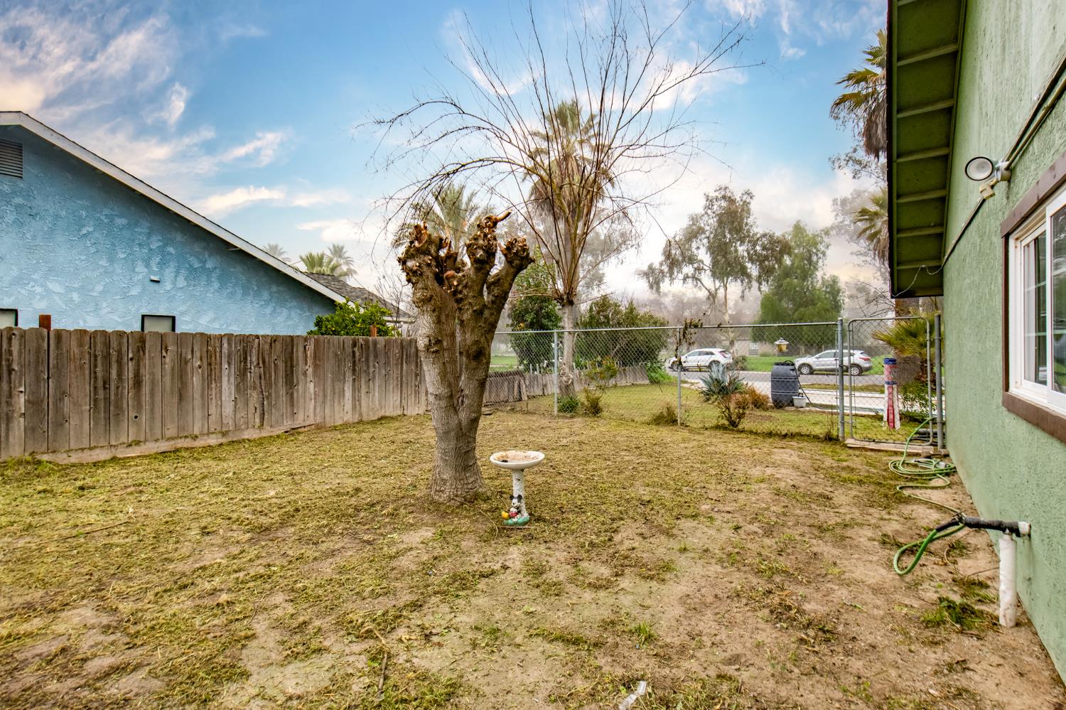 14531 West Kearney Boulevard Kerman, CA 93630 - Photo 16 of 22 a view of a yard with wooden fence