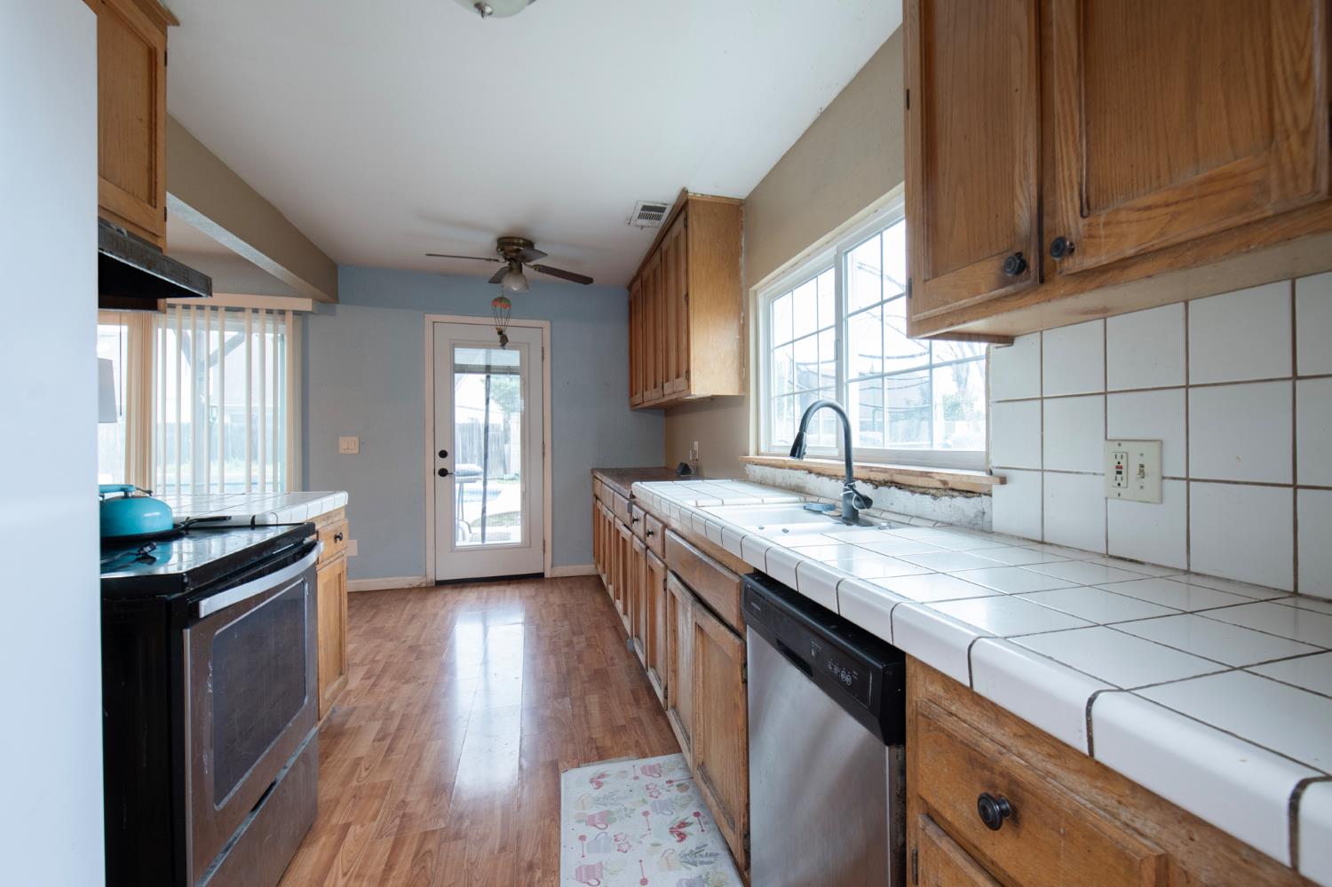 14531 West Kearney Boulevard Kerman, CA 93630 - Photo 10 of 22 a kitchen with sink and cabinets