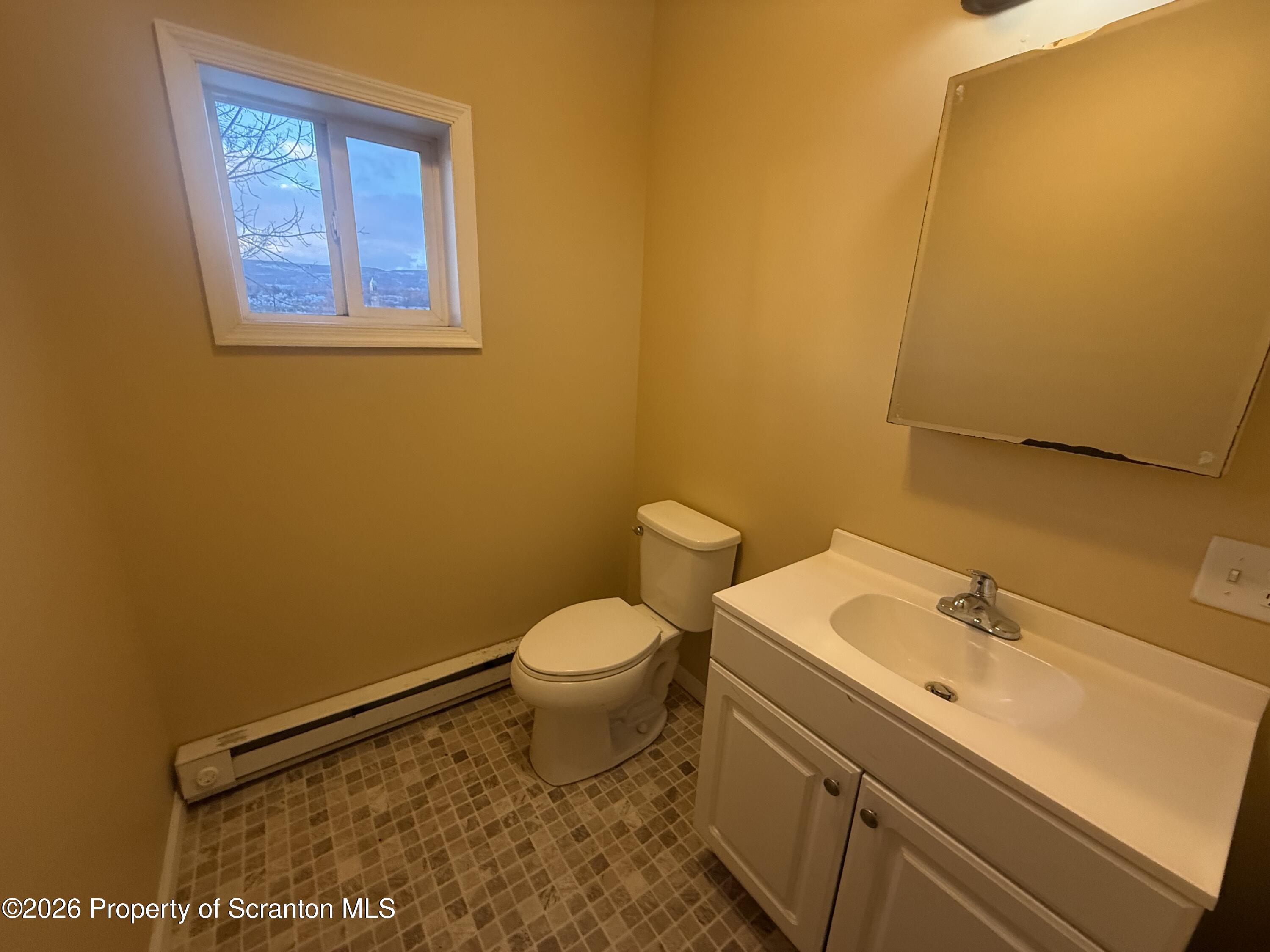 1409 Sanderson Avenue, Unit 2 Scranton, PA 18509 - Photo 8 of 9 a bathroom with a sink and a toilet