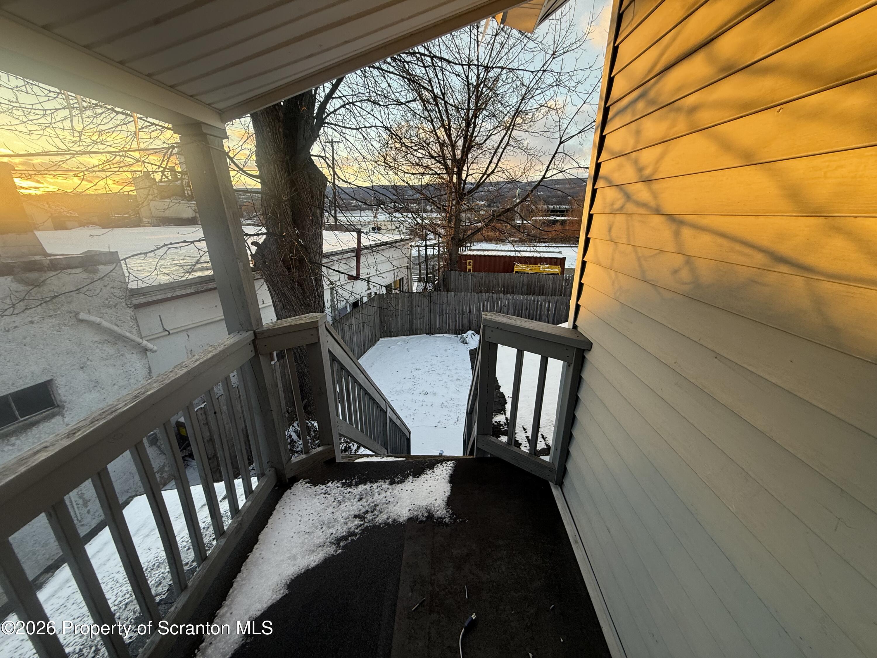 1409 Sanderson Avenue, Unit 2 Scranton, PA 18509 - Photo 9 of 9 a view of balcony with wooden floor and fence
