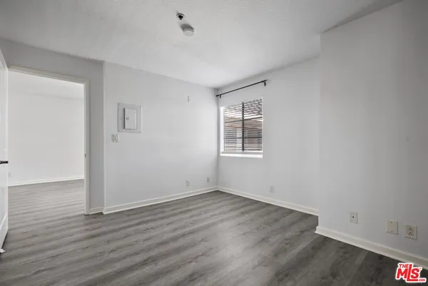a bedroom with a bed and couch
