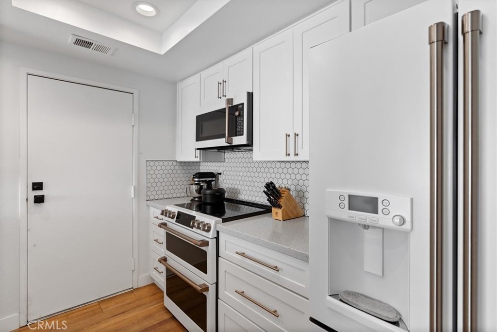 16873 Donwest Tustin, CA 92780 - Photo 13 of 42 a kitchen with a sink and cabinets