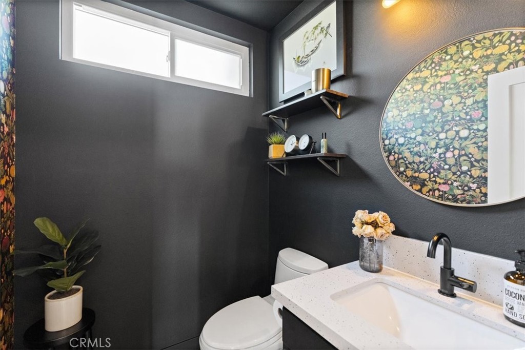 16873 Donwest Tustin, CA 92780 - Photo 19 of 42 a bathroom with a toilet sink and mirror