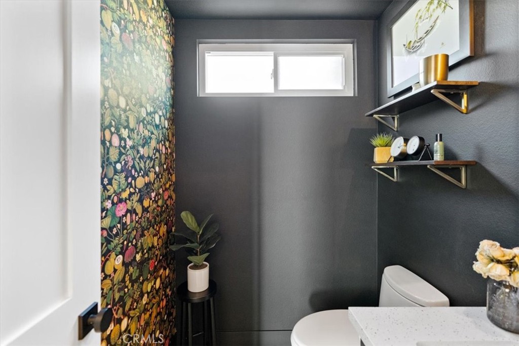 16873 Donwest Tustin, CA 92780 - Photo 20 of 42 a bathroom with a toilet sink and mirror