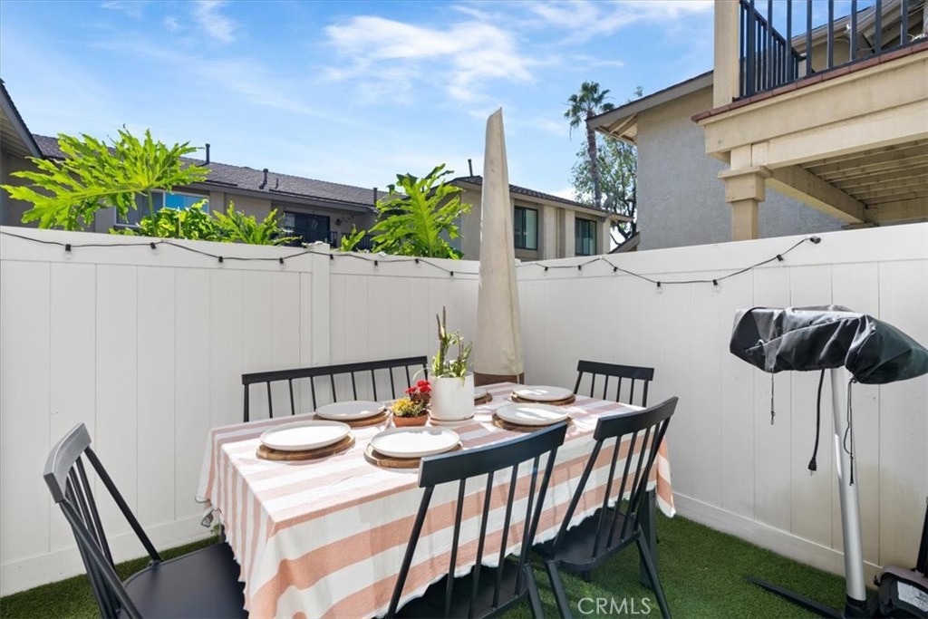 16873 Donwest Tustin, CA 92780 - Photo 21 of 42 a balcony with a table and chairs