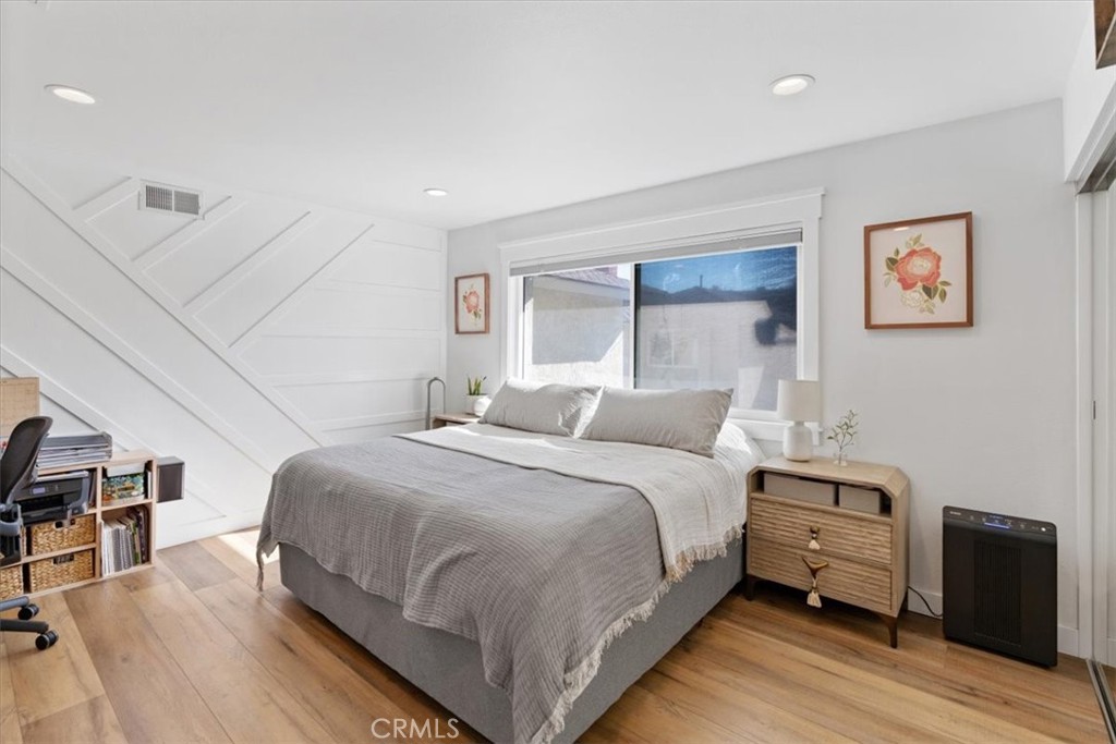 16873 Donwest Tustin, CA 92780 - Photo 32 of 42 a bedroom with a bed and wooden floor